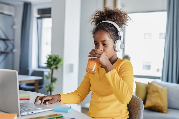 Cute girl doing online school
