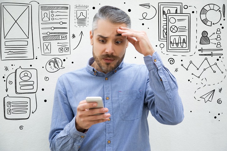 Confused man trying to deal with bad UX