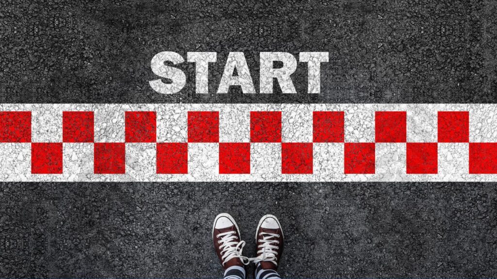 A person standing over the starting line.
