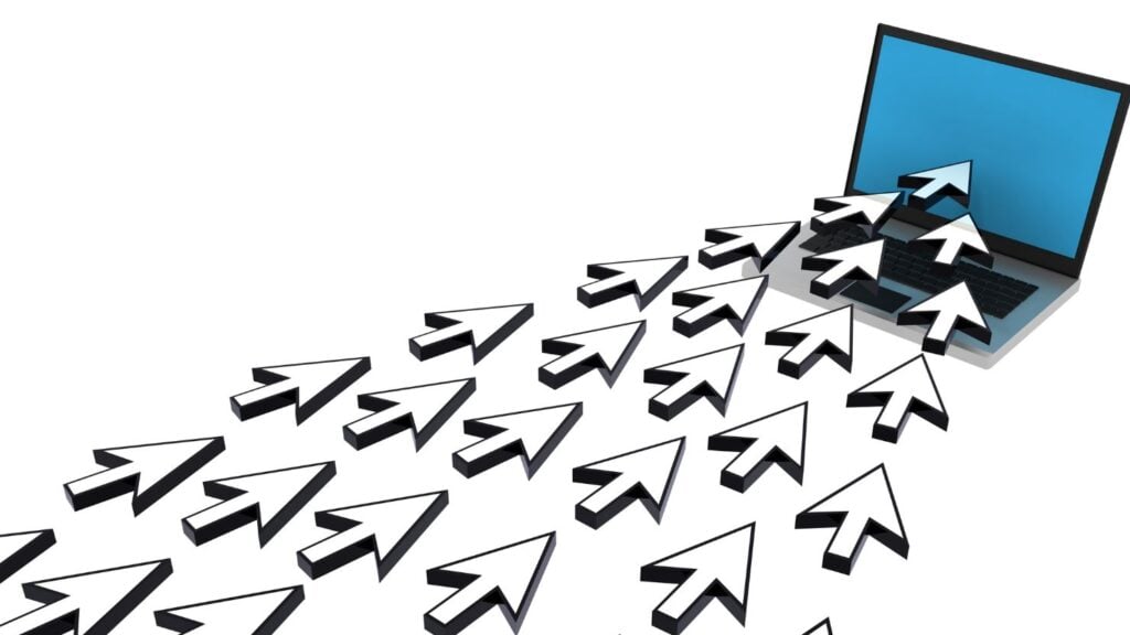 Website Traffic represented by mouse click arrows flying into a laptop's screen