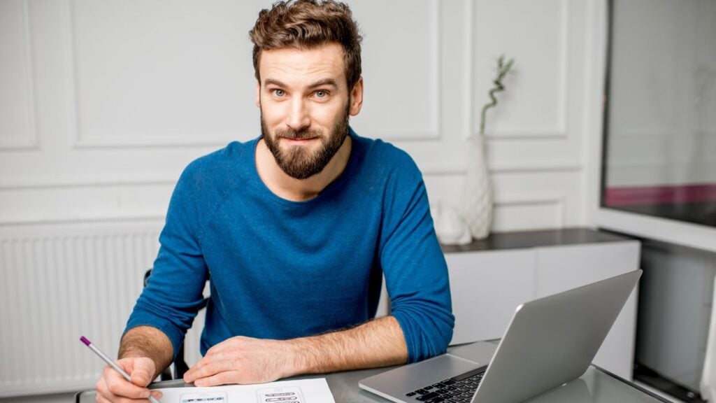 User Experience Designer Working at the Office