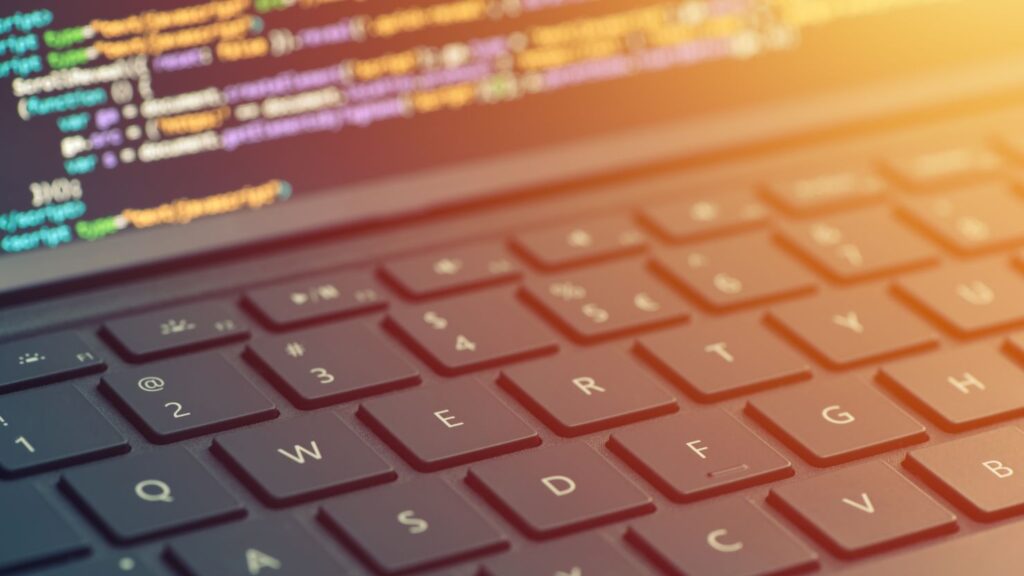 Closeup coding on screen, hands coding html and programming on screen laptop, web development, developer